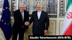 Iranian Foreign Minister Mohammad Javad Zarif (right) meets with EU envoy Josep Borrell at the Foreign Ministry in Tehran on February 3.