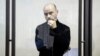 Andrei Pivovarov stands behind the glass during a court hearing in Krasnodar on June 2.
