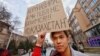 In Almaty, Kazakhstan, a man holds a sign reading: "Coronavirus, we are not afraid of you!"