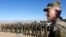 U.S. Army General John Nicholson, the commander of Resolute Support forces and U.S. forces in Afghanistan, speaks with Afghan police special forces in the southeastern Logar province on November 30.