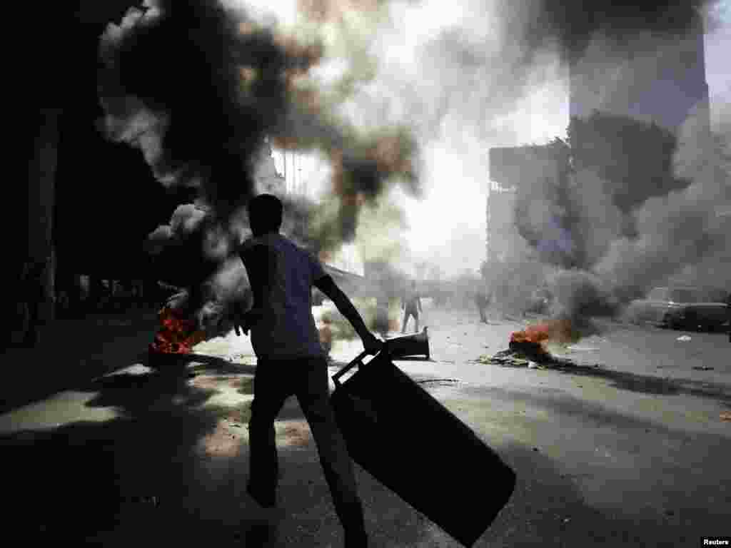 Burning barricades during a demonstration in Cairo on January 28.