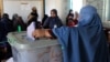 An Afghan woman casts her vote during the parliamentary elections in Kandahar on October 27, 2018.