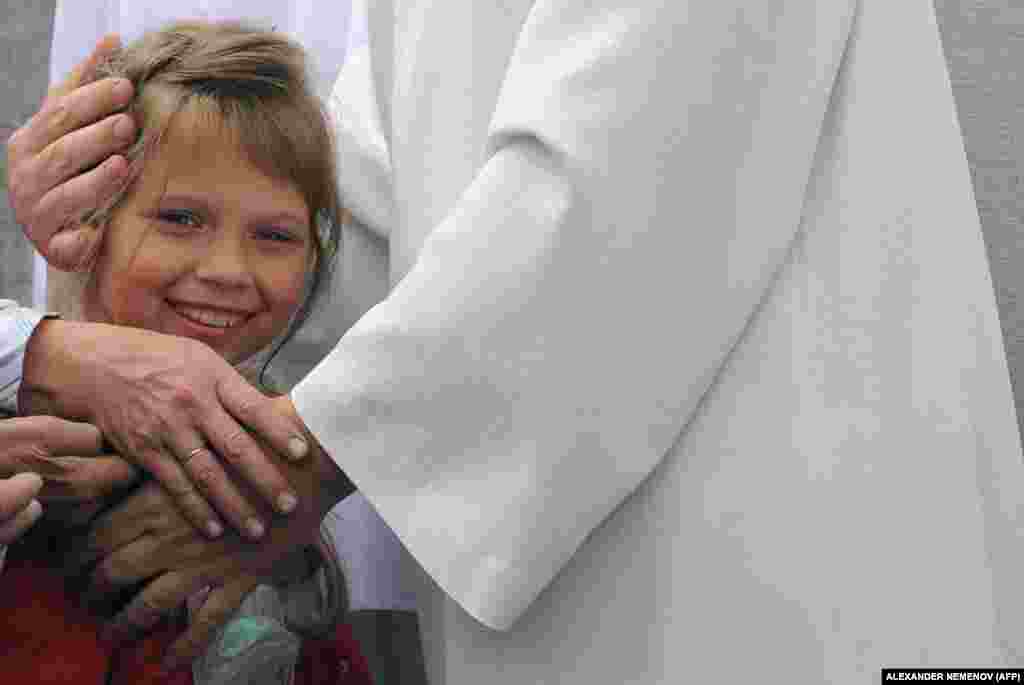 Vissarion hugs a small girl while meeting with his followers in 2009. Priests from Russia&#39;s Orthodox Church have also spoken out against the new religion, with one saying that &quot;complete isolation from society is never ever good for people.&quot; &nbsp; &nbsp;
