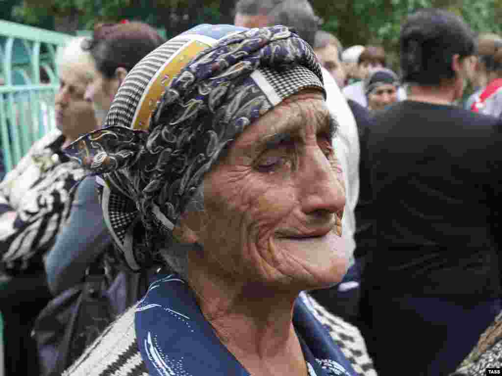 An old woman mourns at the site of a suicide car bomb blast in Vladikavkaz, the capital of the North Caucasus republic of North Ossetia, on September 9. At least 17 people were killed in the attack in the city's busy central market. Some 100 others were injured. Photo by Sergei Uzakov for ITAR-TASS