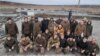 Ukrainian prisoners of war pose after a swap in the Zaporizhzhya region on November 24.