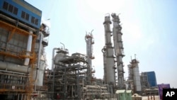 FILE - In this Sept. 4, 2018 file photo, released by an official website of the office of the Iranian Presidency shows a part of the Pardis petrochemical complex facilities in Assalouyeh on the northern coast of the Persian Gulf, Iran. Bijan Zanganeh, Ira