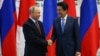 RUSSIA -- Russian President Vladimir Putin (left) meets with Japanese Prime Minister Shunzo Abe in the far-eastern port city of Vladivostok, September 10, 2018