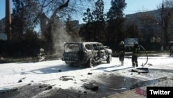 Firefighters in Mariupol extinguish a car in which Colonel Oleksandr Kharaberyush from Ukraine's intelligence service was killed on March 31. 