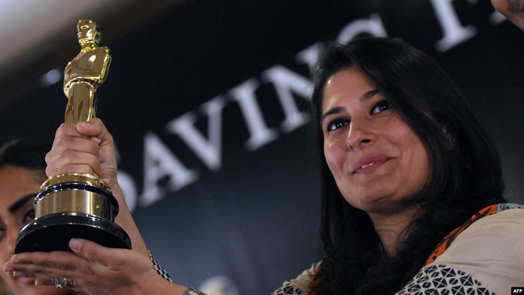 Pakistani director Sharmeen Obaid-Chinoy poses for photographs with the Academy Award she won in 2012 for a documentary on acid attacks on Pakistani women. Her latest movie tackles the subject of 'honor killings' in Pakistan, which she says claims the lives of hundreds of women every year.