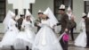 Couples take part in a mass wedding ceremony in the capital Bishkek in 2012.