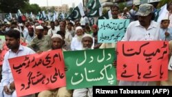 Pakistani people protest against U.S. President Donald Trump during a demonstration in Karachi on August 30.