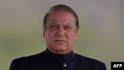 Pakistani Prime Minister Nawaz Sharif looks on as he waits for the arrival of Pakistani at the venue of the Pakistan Day military parade in Islamabad, March 23.