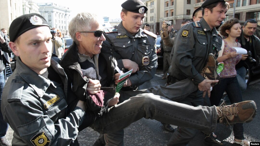 Russian police detain an opposition activist at a rally protesting the bill.