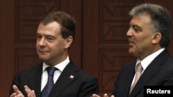 Turkish President Abdullah Gul (right) and his Russian counterpart, Dmitry Medvedev, in Ankara today