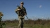 A Ukrainian border guard patrols the frontier with Romania in the Chernivtsi region