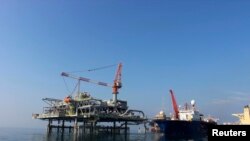 Iraq -- A ship is docked at Al-Basra oil terminal, next to a Central Meeting and Manifold Platform belonging to Iraq's Southern Oil Company in the Middle East Gulf, November 27, 2013