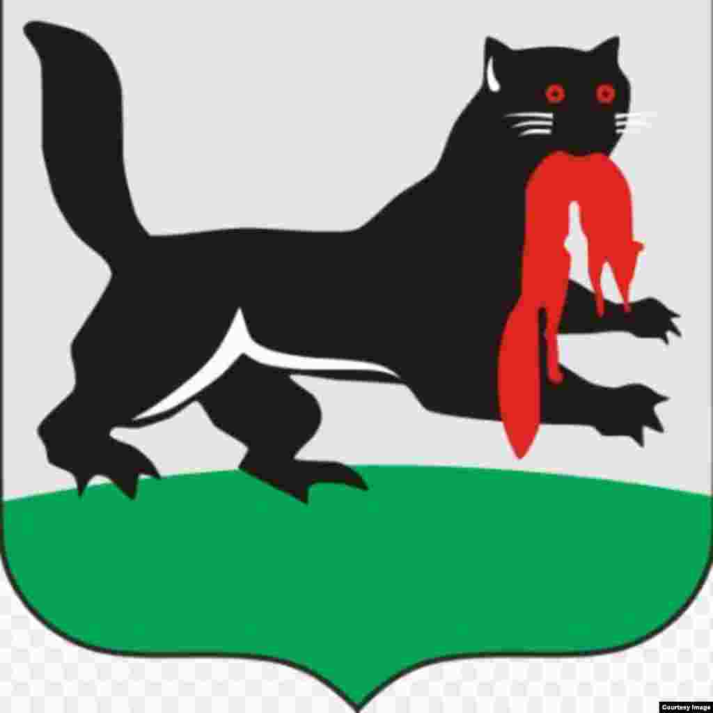 The flag of Irkutsk featuring an unknown creature that appears, according to Russia-watcher Michael Elgort, to be a beaver with the legs of a platypus holding a fox in its mouth. (Looks more like a cat of some kind than a beaver to us, but no matter.)