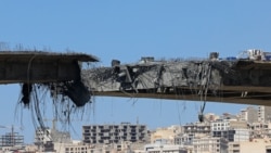A view of the B1 bridge is pictured after it was destroyed by a strike in Karaj, around 20miles (35kms) southwest of Tehran.