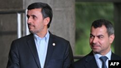 Brazil -- Iranian President Mahmud Ahmadinejad (L) and Syrian reprsentative at the UN Conference on Sustainable Development Rio+20 family photo, in Rio de Janeiro, 20Jun2012