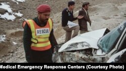 The rescue team from Balochistan's Medical Emergency Response Center at the site of a crash on May 31.