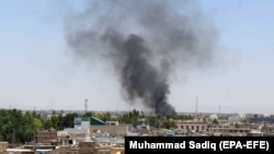 Smoke billows from the scene of a bomb explosion in Kandahar on May 22.