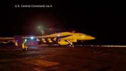 Photo provided by US Central Command shows a jet preparing for the latest wave of strikes on strategic Iranian sites.