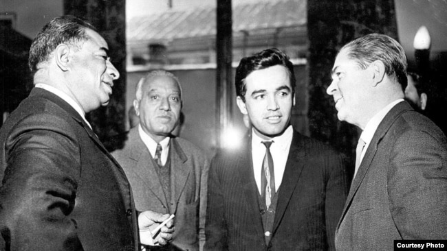 Ahmad Ali Kohzad (second left) stands with Asghar Khan (left), a high-ranking personality from Afghanistan, and two others from Uzbekistan.