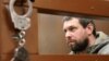 Former Russian police officer Denis Konovalov, at a court hearing in Moscow on February 26. 