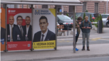 Sarajevo, Bosnia and Herzegovina young people in front of election billboards 