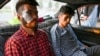 Neamat Naqdi and Taqi Daryabi, journalists for the Afghan newspaper Etilaat-e Roz, arrive at their office after being detained and beaten by the Taliban in Kabul on September 8.