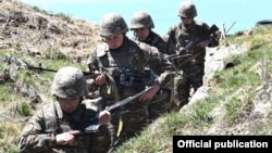 Armenian soldiers take up positions on the border with Azerbaijan on May 17.