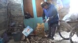 Kyrgyzstan - Woman collects animal bones to make money