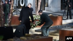 Belgium's King Philippe lays a wreath during the inauguration of a memorial as the country marks the first anniversary of the twin Brussels attacks on March 22.