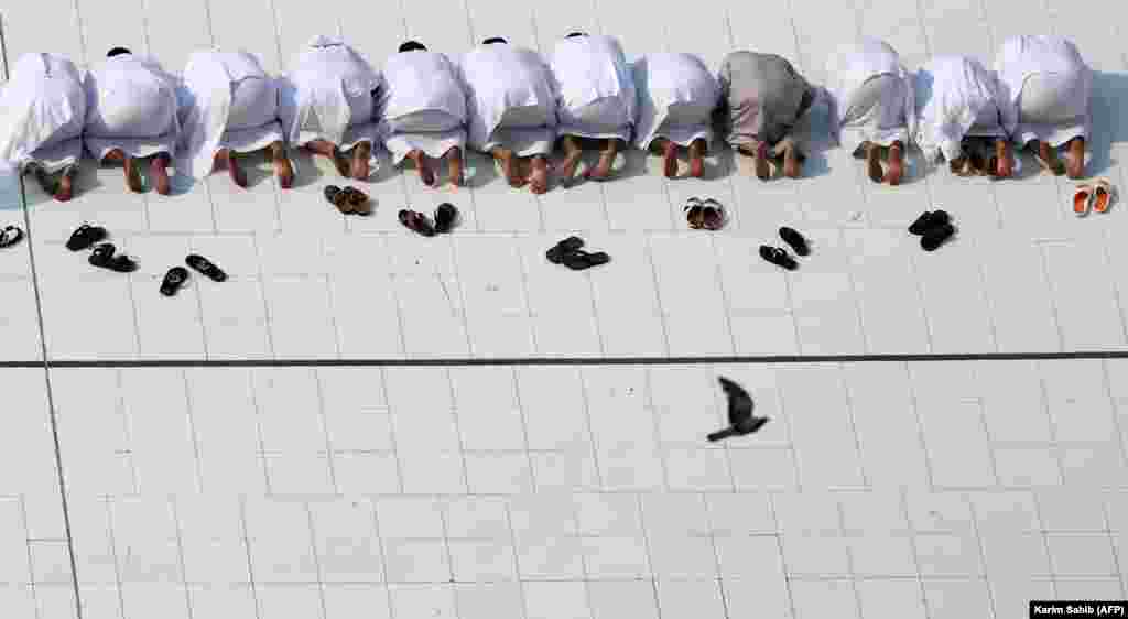 Muslim worshippers perform prayers around the Kaaba, Islam&#39;s holiest shrine, at the Grand Mosque in Saudi Arabia&#39;s holy city of Mecca, prior to the start of the annual hajj pilgrimage. (AFP/ Karim Sahib)