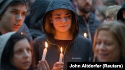 People mourn the loss of life as they hold a vigil for the victims of a fatal shooting at a Pittsburgh synagogue on October 27. 