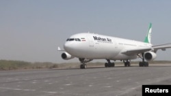 A Mahan Air plane lands at what is identified as Hodeidah Airport in Yemen, in a screen grab from a handout video released by Al Masirah TV on July 13, 2026.