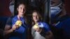 KOSOVO -- Kosovo's Gold medallists judokas Nora Gjakova (Left) and Distria Krasniqi pose with their medals during a welcoming ceremony in Pristina on August 2, 2021 upon their arrival from Tokyo.