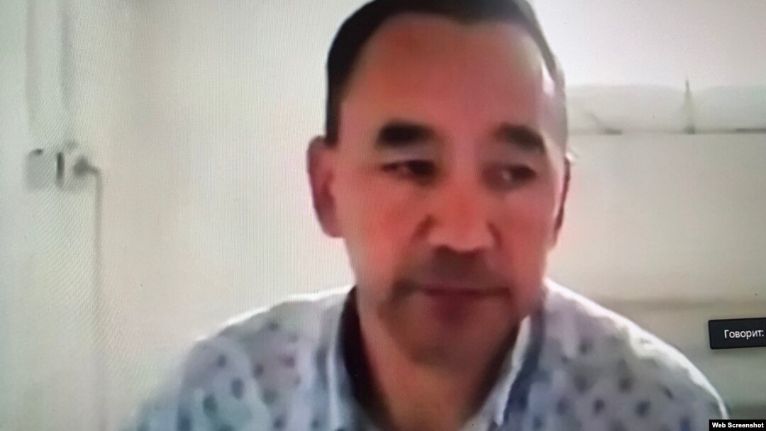 Activist Erbol Eskhozhin is seen during his trial, which was held online.