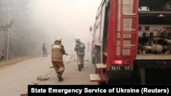 Ucraina: pompieri în zona de excludere din apropierea centralei nucleare de la Cernobîl, aprilie 2020