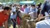 Survivors and relatives of Srebrenica victims bury their dead during a ceremony on July 11