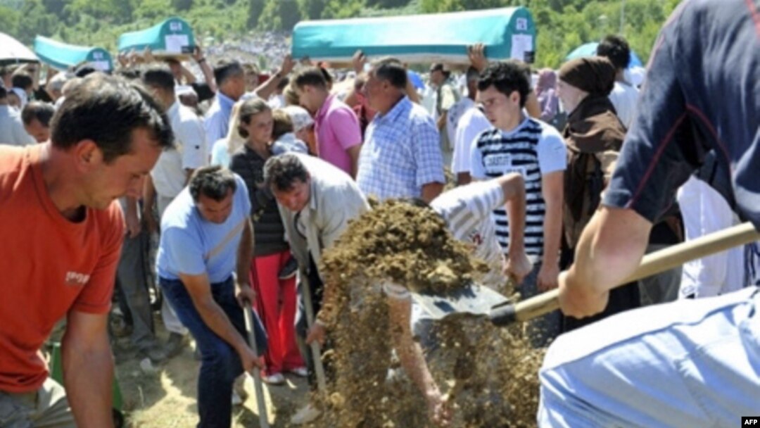 Survivors and relatives of Srebrenica victims bury their dead during a ceremony on July 11
