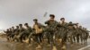 FILE: Afghan National Army (ANA) soldiers march during a training exercise of a graduation ceremony at a training center in Herat province on April 15.