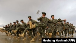 FILE: Afghan National Army (ANA) soldiers march during a training exercise of a graduation ceremony at a training center in Herat province on April 15.