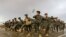 FILE: Afghan National Army (ANA) soldiers march during a training exercise of a graduation ceremony at a training center in Herat province on April 15.