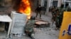 Iraqi security forces clash with demonstrators during anti-government protests in Baghdad on November 26.