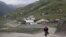 A woman on a road in the settlement of Akhty in southern Daghestan.