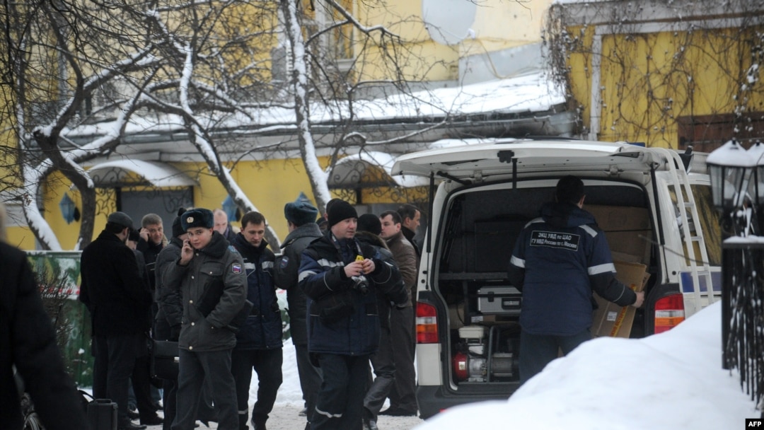 Russian police officers and investigators crowd at the site of the killing of Aslan Usoyan, better known as "Ded Khasan" (Grandfather Khasan), outside the Karetny Dvor restaurant in central Moscow in mid-January.