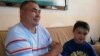 Tatarstan -- Fanis Nuretdinov, armwrestler from Tatarstan with his son