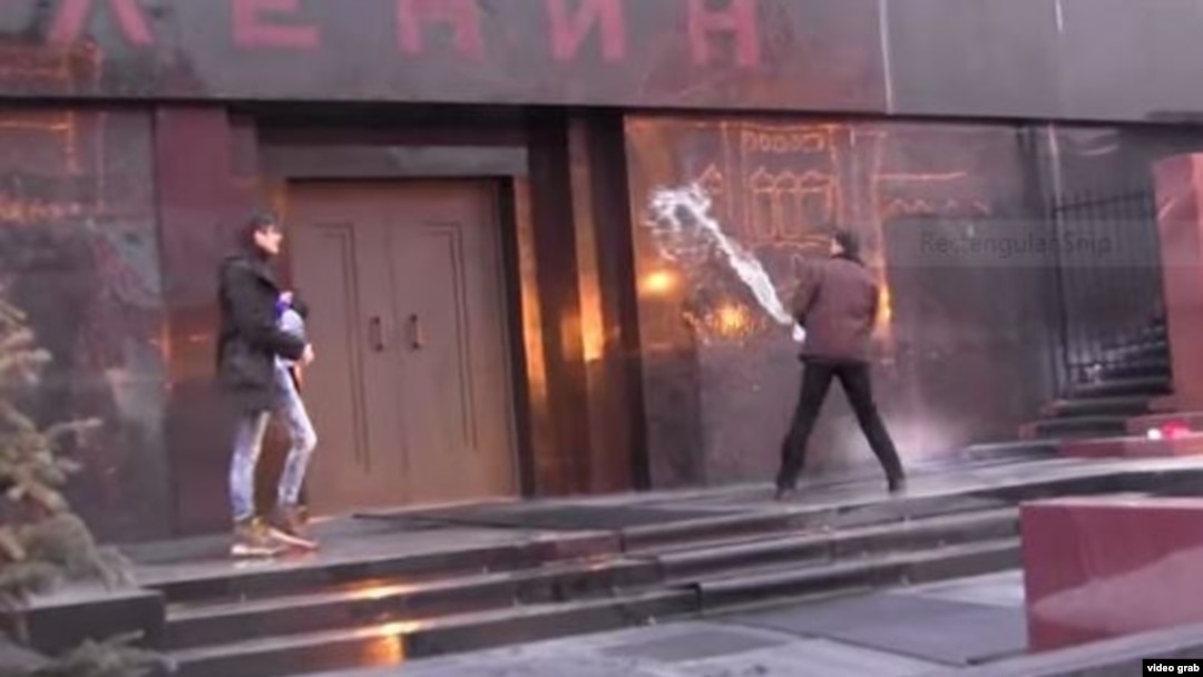 Two St. Petersburg performance artists staged a mock exorcism at Lenin's Mausoleum on Red Square.