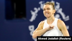 Simona Halep celebrates after winning the final in Dubai in February 2020.